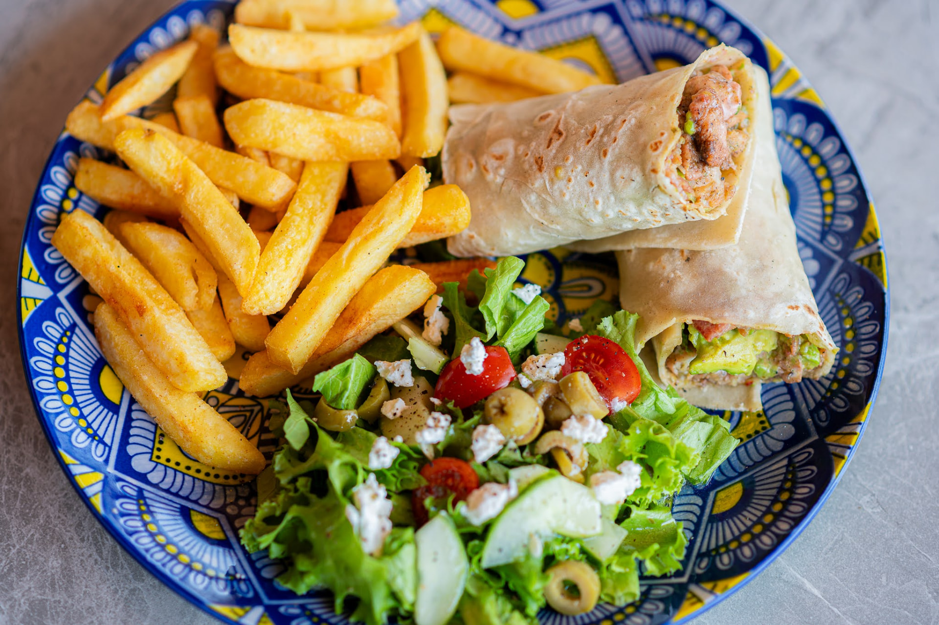 Chicken, bacon and avo wrap served with chips and a fresh side salad